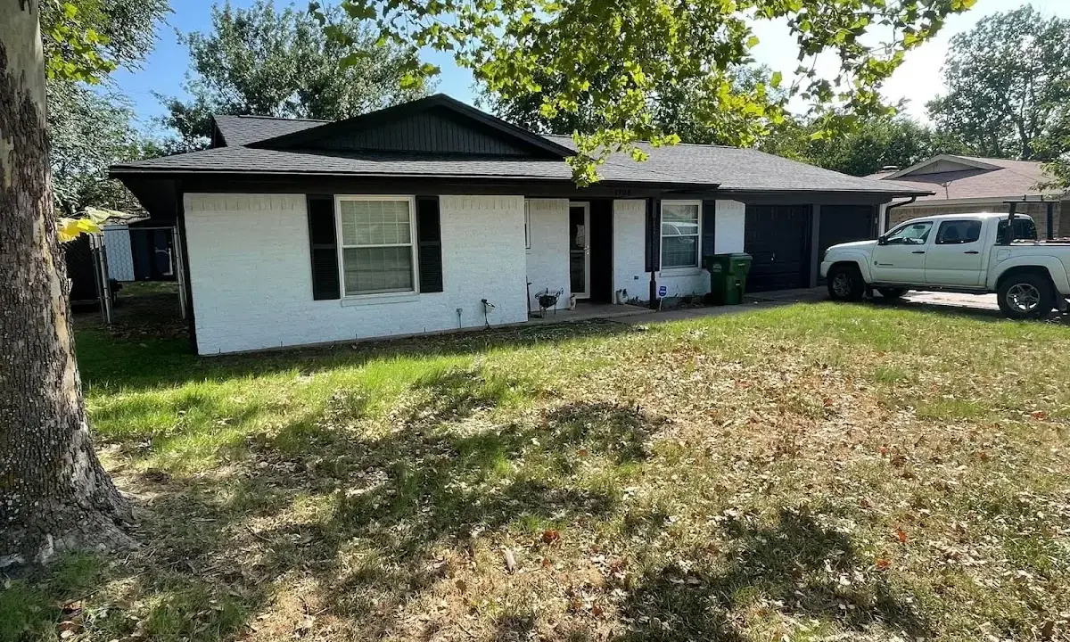 Professional roofing crew working on a residential roof in Michigan City